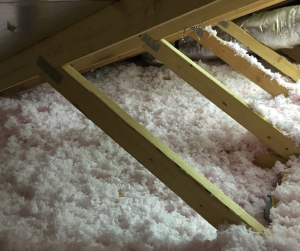 slanted beams in attic with insulation